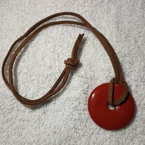 leather and red necklace